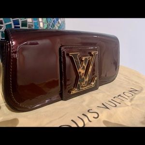 Louis Vuitton Sobe burgundy patent clutch